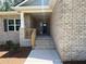 Brick house featuring a covered front entrance and large window at 3402 Milan Ct, Douglasville, GA 30135