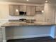 Bright kitchen features a large island, granite countertops, and stainless steel appliances at 3402 Milan Ct, Douglasville, GA 30135