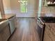 Modern kitchen with granite countertops, stainless steel appliances, and eat-in area at 3402 Milan Ct, Douglasville, GA 30135