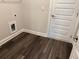 A utilitarian laundry room with wood-style floors at 3402 Milan Ct, Douglasville, GA 30135