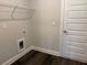 Bright laundry area with a white wire shelf and convenient outlet for appliances at 3402 Milan Ct, Douglasville, GA 30135