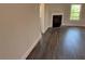 Living room with hardwood floors, fireplace, and natural light from the windows at 3402 Milan Ct, Douglasville, GA 30135