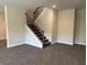 Spacious living room featuring carpeting, white trim, and a staircase at 3402 Milan Ct, Douglasville, GA 30135