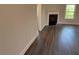 Living room with hardwood floors, fireplace, and natural light from the windows at 3402 Milan Ct, Douglasville, GA 30135