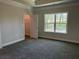 Spacious bedroom with large window and walk-in closet at 3402 Milan Ct, Douglasville, GA 30135