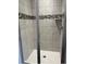 Modern shower stall featuring tile and glass door at 3402 Milan Ct, Douglasville, GA 30135