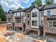 Modern townhome with brick facade, attached garages, and neutral-toned siding at 6 Rock Park Way # 15, Tucker, GA 30084