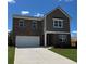 Two-story home featuring a two-car garage, brick facade and a well-manicured lawn at 2289 Argento Cir, Dacula, GA 30019
