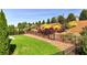 Beautifully landscaped backyard with lush green grass and a variety of plants and trees at 5640 Hammock Way, Cumming, GA 30028
