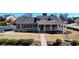 Charming clubhouse with a welcoming front porch and well-maintained landscaping at 5640 Hammock Way, Cumming, GA 30028