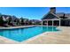 Inviting community pool with a clear blue water, surrounded by lounge chairs at 5640 Hammock Way, Cumming, GA 30028