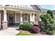 Charming front porch with brick accents, decorative plants, and clear house number at 5640 Hammock Way, Cumming, GA 30028