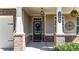 Inviting front porch with stylish details and well-maintained landscaping at 5640 Hammock Way, Cumming, GA 30028