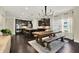 Open concept kitchen with dark wood floors, dark cabinets and stainless steel appliances at 5640 Hammock Way, Cumming, GA 30028