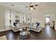 Comfortable living room with vaulted ceiling, lots of natural light, and hardwood flooring at 5640 Hammock Way, Cumming, GA 30028