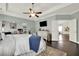 Bright main bedroom with a ceiling fan, and a sitting area or home office at 5640 Hammock Way, Cumming, GA 30028