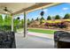 Covered patio overlooking a professionally landscaped backyard with lush greenery and privacy fence at 5640 Hammock Way, Cumming, GA 30028