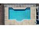 Aerial view of a community pool featuring crystal clear water and easy access ladder steps at 5640 Hammock Way, Cumming, GA 30028