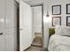 Bedroom view featuring a walk-in closet with adjustable shelving units for optimal storage capacity and clean modern lines at 5640 Hammock Way, Cumming, GA 30028
