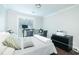 Bright bedroom featuring a dedicated workspace and sleek black dresser for ample storage at 787 Mckendree Lake Way, Lawrenceville, GA 30043
