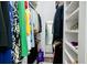 Walk-in closet with ample hanging space and built-in shelving for optimal storage in the home at 787 Mckendree Lake Way, Lawrenceville, GA 30043