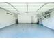 Spacious garage with epoxy flooring, storage cabinets, and bicycle rack, perfect for organization at 787 Mckendree Lake Way, Lawrenceville, GA 30043
