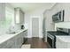 Stylish kitchen with gray cabinets, modern appliances, and a clean, bright design at 787 Mckendree Lake Way, Lawrenceville, GA 30043