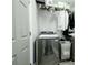 Well-organized laundry room with modern washer, ample storage, and convenient shelving for supplies at 787 Mckendree Lake Way, Lawrenceville, GA 30043