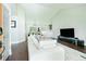 Bright and airy living room with an open floor plan flowing into the kitchen and dining area at 787 Mckendree Lake Way, Lawrenceville, GA 30043