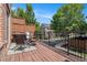 Cozy balcony with wood deck, furniture set, and black iron railing overlooking lush greenery at 1836 Preserve Way, Brookhaven, GA 30341