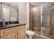 Full bathroom featuring granite countertop vanity, framed mirror, and glass-enclosed shower at 1836 Preserve Way, Brookhaven, GA 30341
