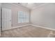 Bedroom with plush carpet and natural light creating a serene and inviting atmosphere at 1836 Preserve Way, Brookhaven, GA 30341