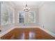 Well-lit dining room with hardwood floors, classic trim, and modern chandelier fixture at 1836 Preserve Way, Brookhaven, GA 30341