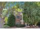Stately brick home with classic architectural details and mature trees in a lush, green setting at 1836 Preserve Way, Brookhaven, GA 30341