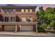 Brick townhome featuring private balconies, attached garages, and manicured landscaping at 1836 Preserve Way, Brookhaven, GA 30341