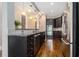 Stylish kitchen boasting granite countertops, stainless steel appliances, dark cabinets and hardwood floors at 1836 Preserve Way, Brookhaven, GA 30341