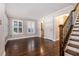 Living room with hardwood floors, staircase, and lots of natural light at 1836 Preserve Way, Brookhaven, GA 30341