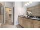 Luxurious main bathroom showcasing double vanity, granite countertop, and walk-in closet at 1836 Preserve Way, Brookhaven, GA 30341