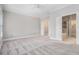 Spacious primary bedroom with neutral carpet, ceiling fan, and ensuite bath access at 1836 Preserve Way, Brookhaven, GA 30341