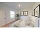 Comfortable bedroom with neutral decor, framed artwork, and soft carpet at 2308 Argento Cir, Dacula, GA 30019