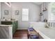 Bright bathroom featuring tub, vanity and hardwood style floors at 306 Overbend Sw Lndg, Marietta, GA 30008