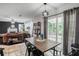 View of dining table and chairs with view into the backyard and living room at 306 Overbend Sw Lndg, Marietta, GA 30008