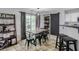 View of dining table and chairs with view into the backyard, adjacent to the kitchen at 306 Overbend Sw Lndg, Marietta, GA 30008