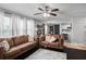 Cozy living room with a view into the dining area and kitchen with large windows at 306 Overbend Sw Lndg, Marietta, GA 30008