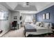Comfortable main bedroom with a modern design, crib, and neutral colors at 306 Overbend Sw Lndg, Marietta, GA 30008