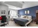 Comfortable main bedroom with a modern design, crib, and neutral colors at 306 Overbend Sw Lndg, Marietta, GA 30008