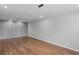 Basement has recessed lighting and wood-look floors, offering ample space for various activities at 397 Lovejoy Cir, Powder Springs, GA 30127