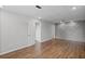 Basement with wood-look floors, recessed lighting, and a door leading to another room at 397 Lovejoy Cir, Powder Springs, GA 30127