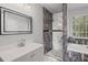 Modern bathroom featuring a large mirror, sleek vanity, and luxurious marble-tiled walk-in shower at 397 Lovejoy Cir, Powder Springs, GA 30127