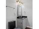 Powder room featuring updated vanity, lighting, and fixtures at 397 Lovejoy Cir, Powder Springs, GA 30127